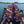 Load image into Gallery viewer, Group of people paddleboarding on a lake with a clear sky.
